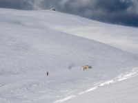 Craig nearing the hut (Ski touring Kirtle Burn Hut August 2021)