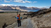 Craig walking down towards Lake Ohau (Ski Touring Snowy Gorge Hut Aug 2021)
