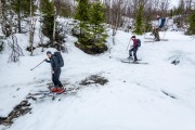 Crossing a stream below the snow (Ski Touring Tromso, April 2022)