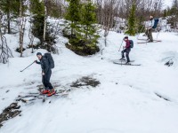 Crossing a stream below the snow (Ski Touring Tromso, April 2022)