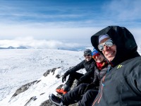Sitting at the top of Botnjfellet (Ski Touring Tromso, April 2022)