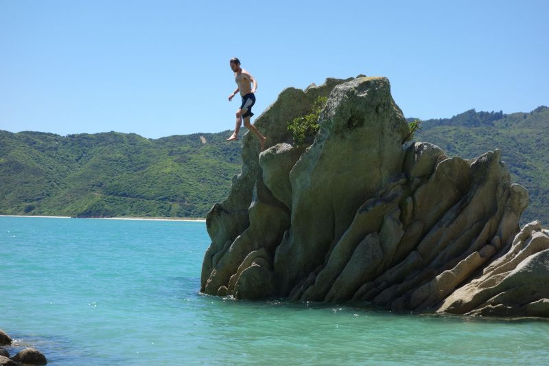 Brendan jumps off the rock (Takaka 2013)
