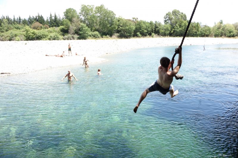 Brendan swinging at paynes ford swimming hole (Takaka 2013)