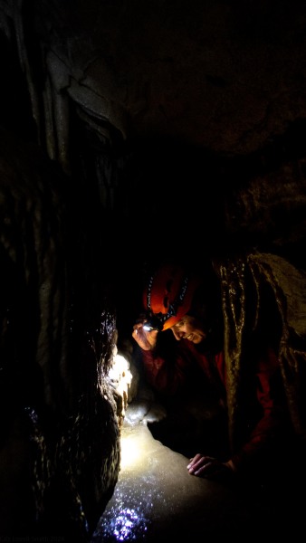 Pip climbing through a tight spot (Te Tahi cave Jan 2025)