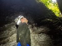 Cris looking up at the exit (Te Tahi cave Jan 2025)