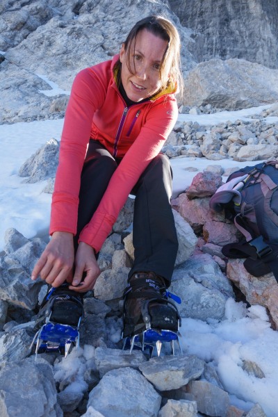 Leonie putting on her crampons (Brenta Dolomites)