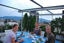 Marie, Jane, and Cris eating dinner on the roof (Zuerich) resize