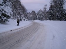 Skiing down the access road (Ski Touring, Schwarzwald, Germany) resize