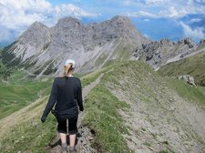 Suvi walks along the ridge (Lungern, Switzerland) resize
