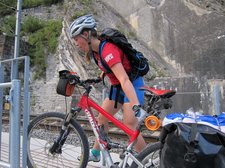 Emily lifts her bike (Switzerland) resize