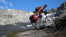Cris pushes his bike up to Sertigpass (Switzerland) resize