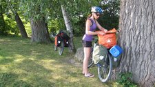 Leonie checks her bag next to the Bodensee (Cycle touring Bodensee) resize