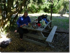 Cris at picnic table at Sandfly Bay (Abel Tasman)_resize