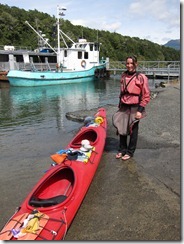 Leonie with kayak about to launch (Seakayaking Manapouri)