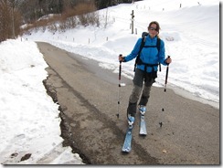 Leonie tries her skis out on the road (Ski tour Belchen)