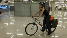 Leonie with packed bike at the airport (Palma, Mallorca) resize