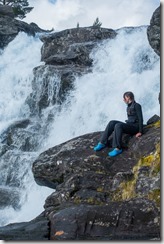 Leonie sitting by the waterfall (Cycle Touring Norway 2016)