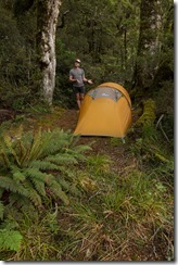 Cris presenting the pitched tent (Klondyke Valley Tracks)