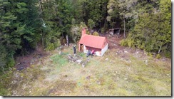 Looking down at the Waingaro Forks Hut from above (MTB Kill Devil Track Aug 2020)
